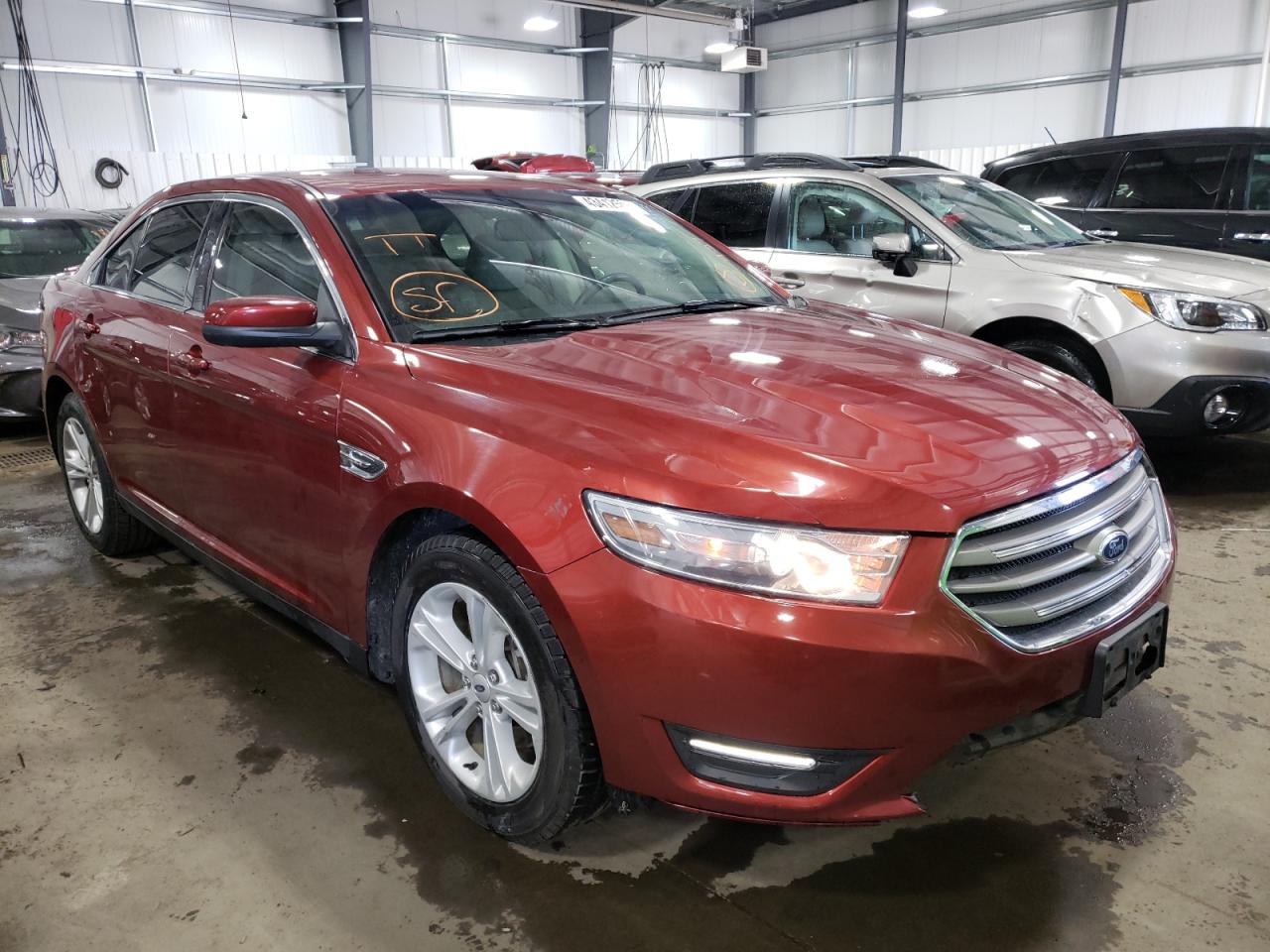 FORD TAURUS SEL 2014 with VIN 1FAHP2E86EG128823 - Photo from auction