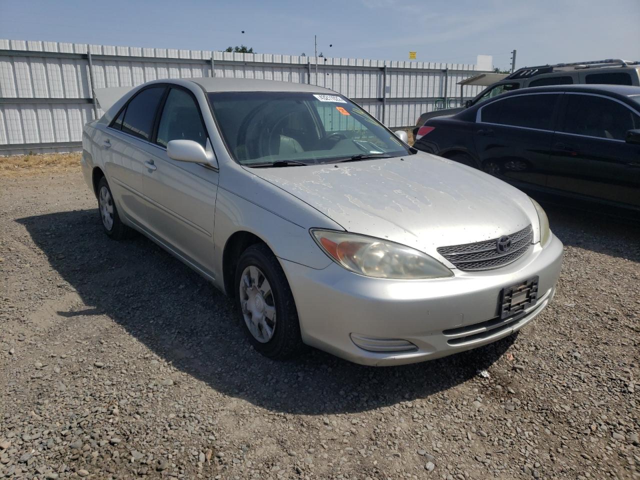 TOYOTA CAMRY LE 2002 with VIN JTDBE32K520124987 - Photo from auction