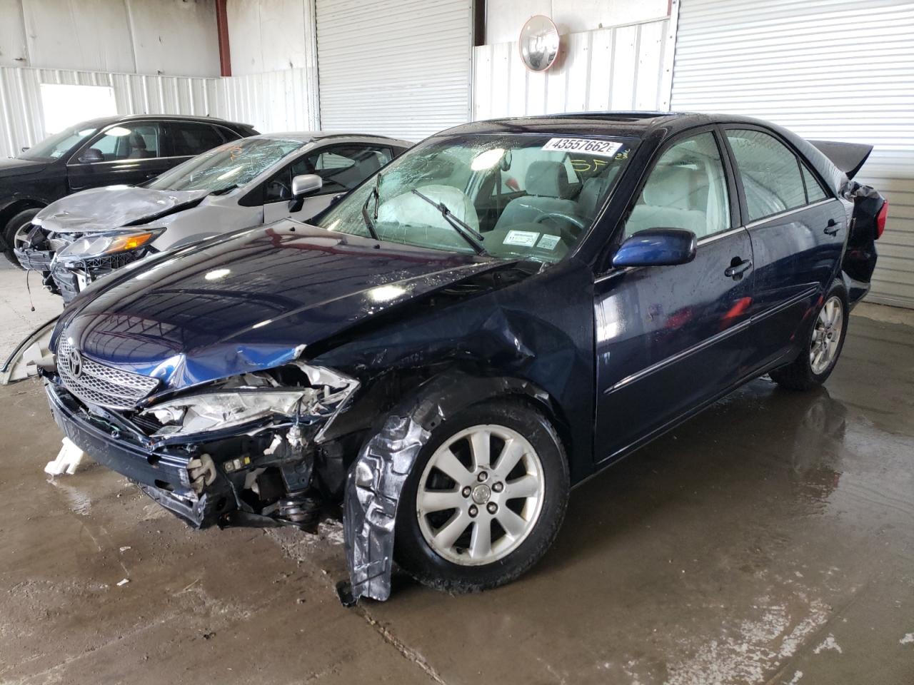 Photo 2 from auction – 2002 TOYOTA CAMRY LE with VIN JTDBE30K520049601