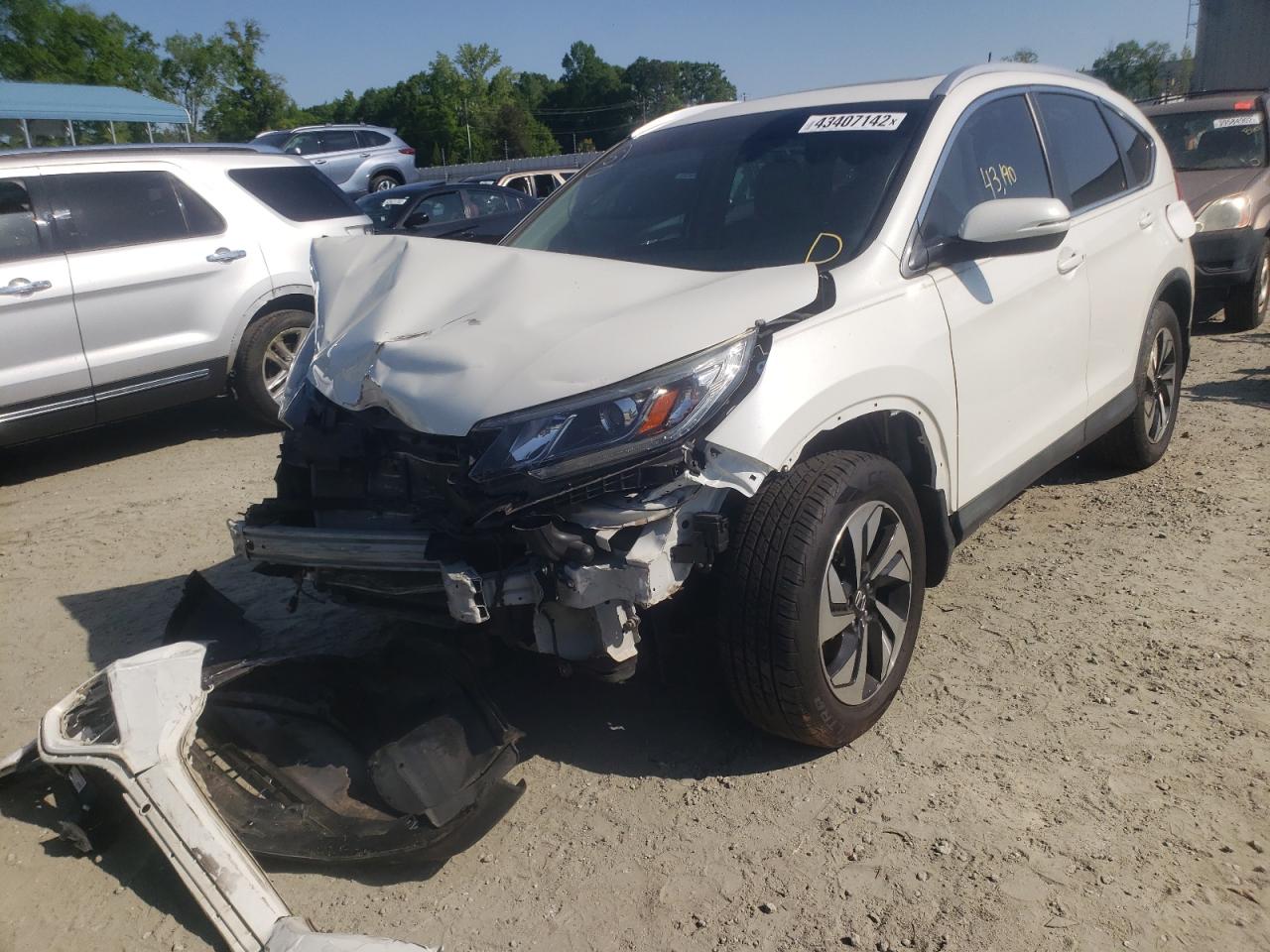 Photo 2 from auction – 2015 HONDA CR-V TOURI with VIN 5J6RM3H90FL019181