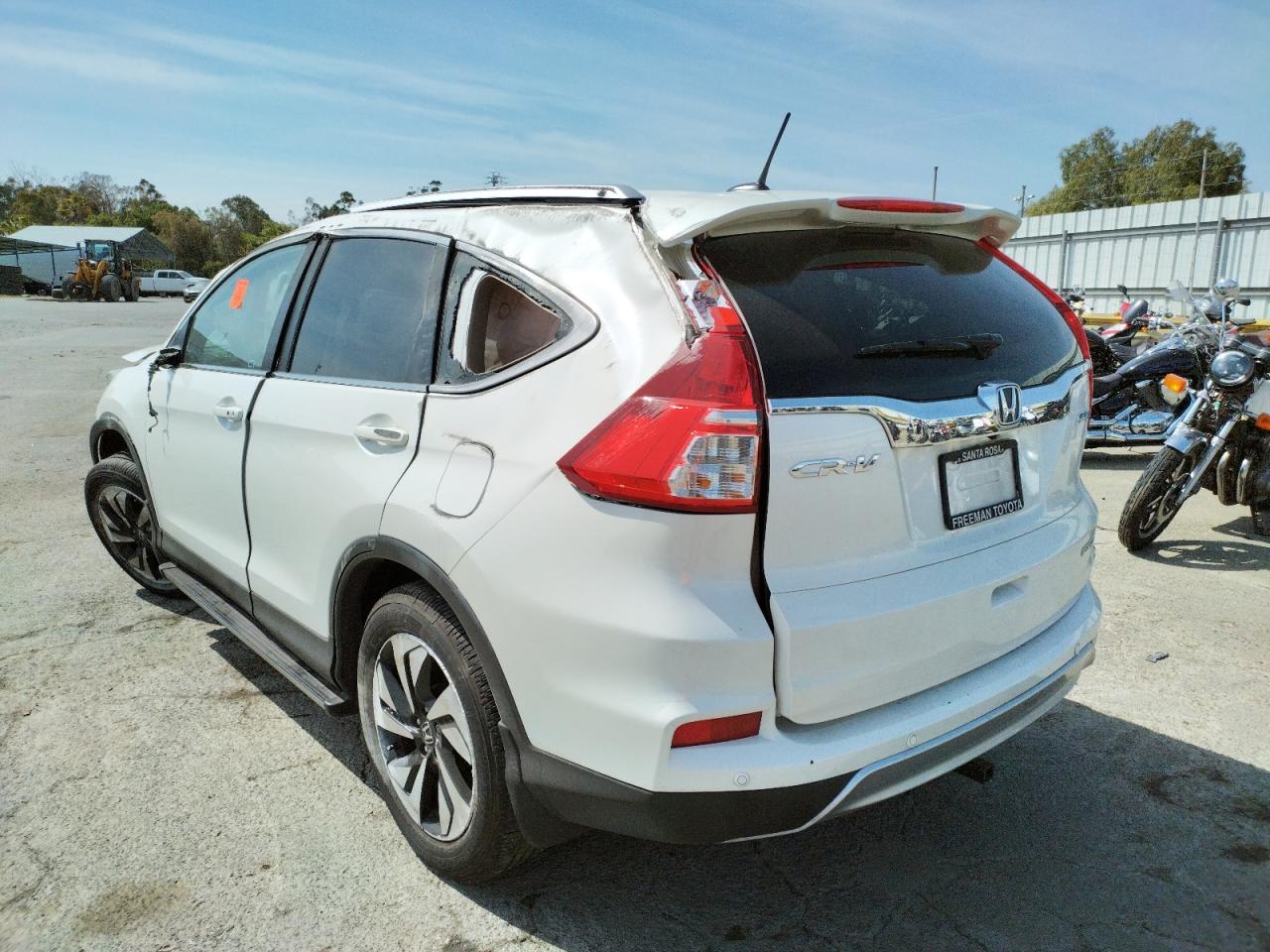 Photo 3 from auction – 2015 HONDA CR-V TOURI with VIN 5J6RM4H99FL070121