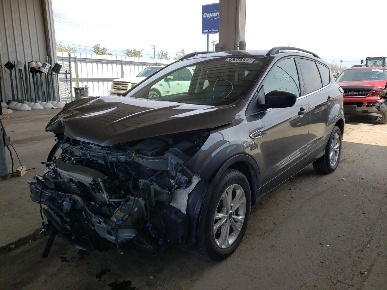 Photo 2 from auction – 2018 FORD ESCAPE SE with VIN 1FMCU0GD4JUB07715
