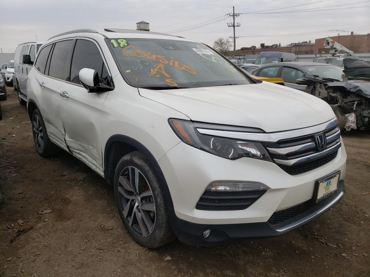 HONDA PILOT ELIT 2018 with VIN 5FNYF6H05JB017999 - Photo from auction