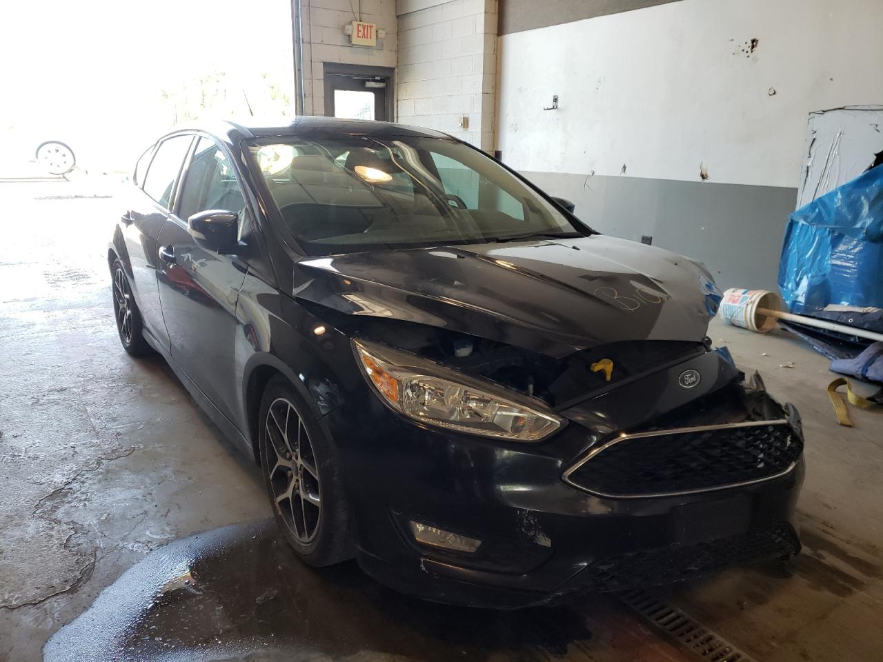 FORD FOCUS 2015 with VIN 1FADP3K21FL362803 - Photo from auction