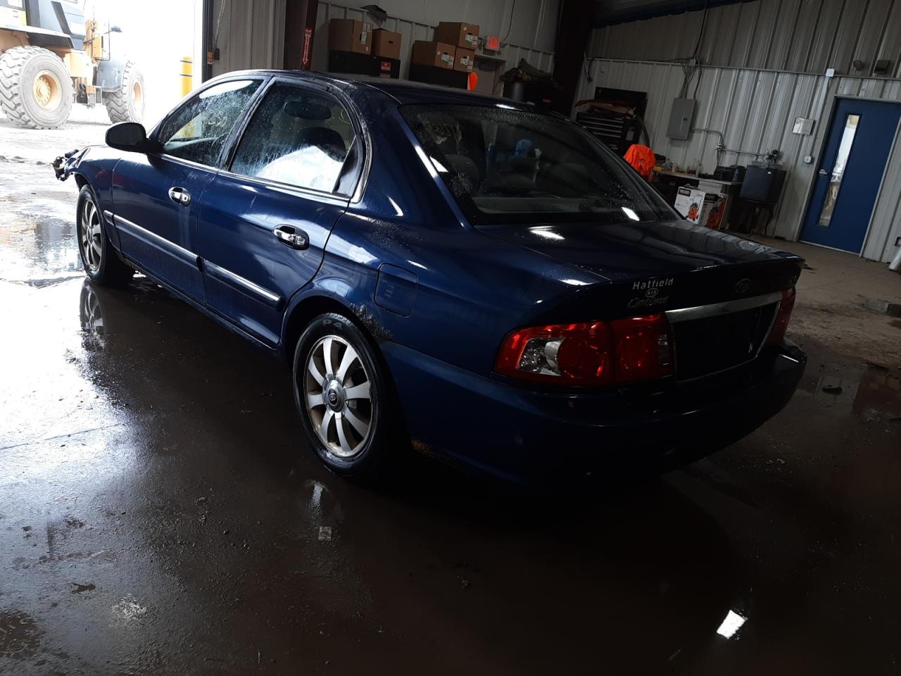 Photo 3 from auction – 2004 KIA OPTIMA LX with VIN KNAGD128945305594