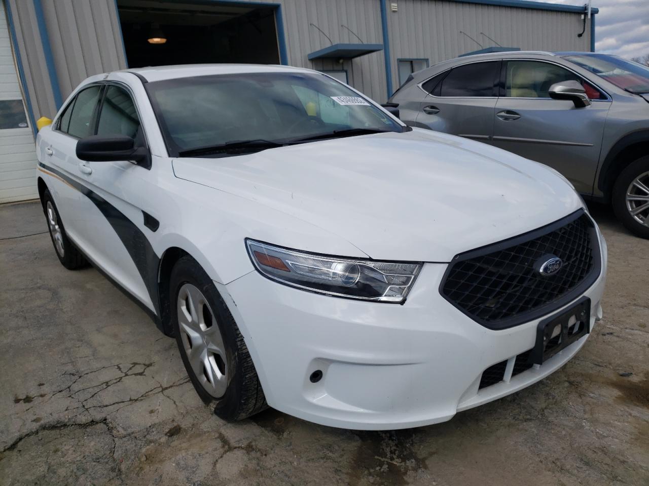 FORD TAURUS POL 2014 with VIN 1FAHP2MKXEG125985 - Photo from auction