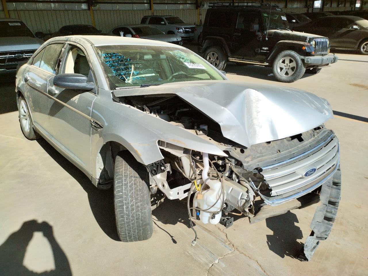 FORD TAURUS SE 2015 with VIN 1FAHP2D88FG204044 - Photo from auction