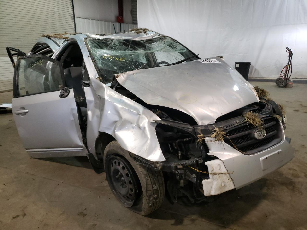 KIA RONDO BASE 2009 with VIN KNAFG528597261082 - Photo from auction