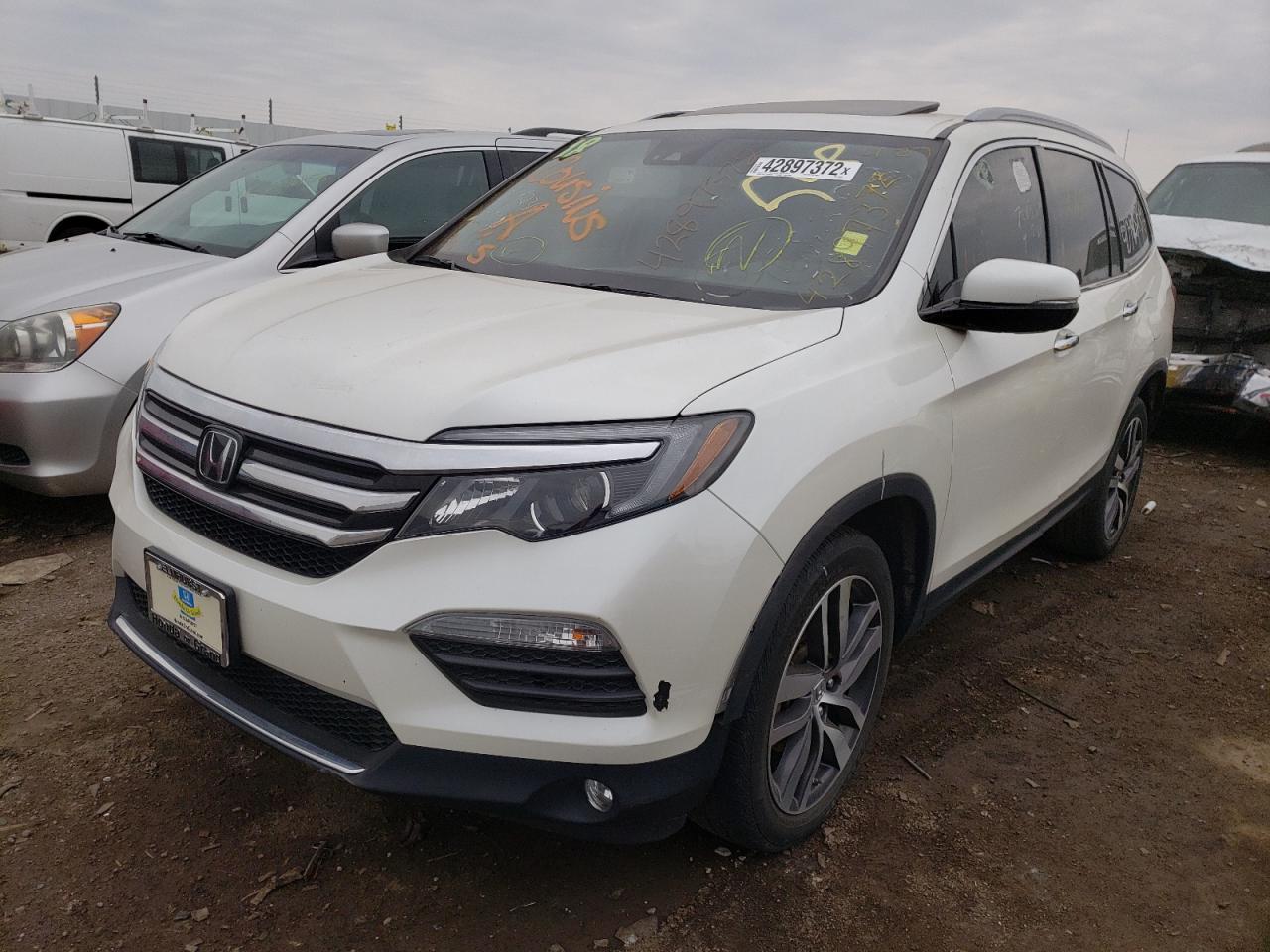 Photo 2 from auction – 2018 HONDA PILOT ELIT with VIN 5FNYF6H05JB017999