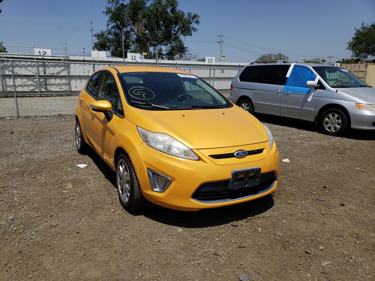 FORD FIESTA SES 2011 with VIN 3FADP4FJ8BM125256 - Photo from auction