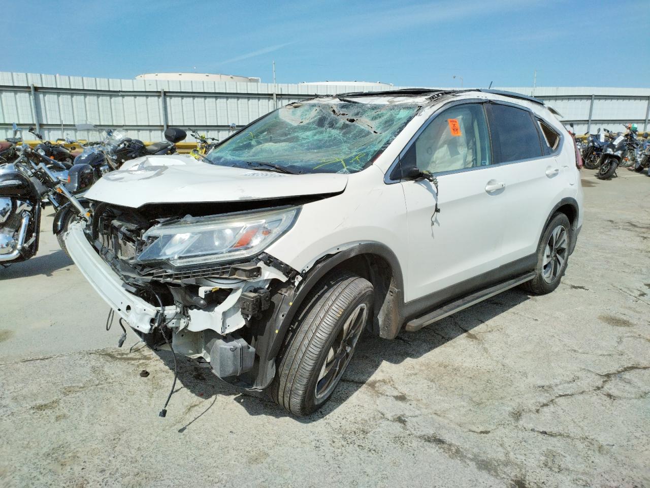 Photo 2 from auction – 2015 HONDA CR-V TOURI with VIN 5J6RM4H99FL070121