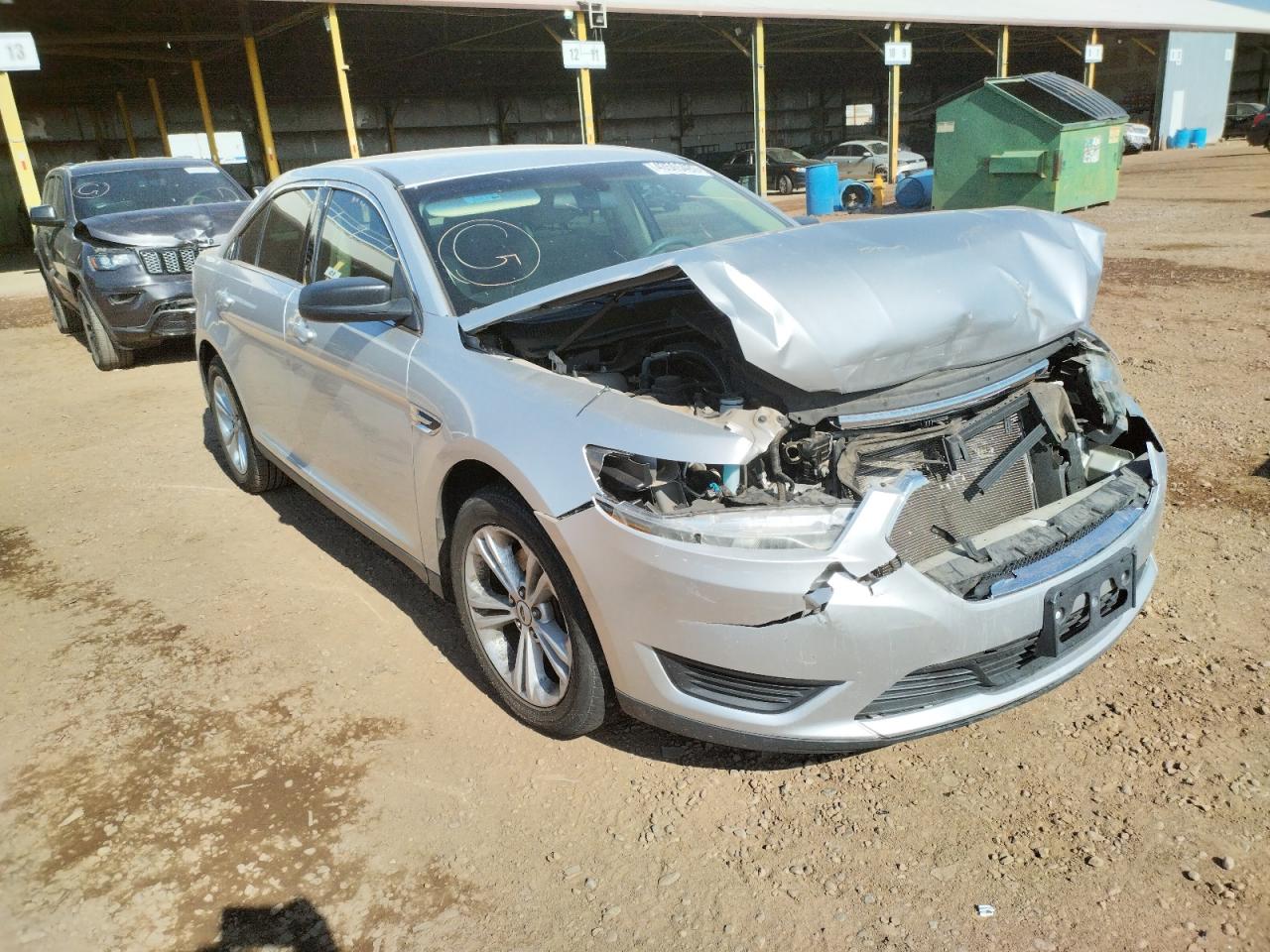 FORD TAURUS SE 2015 with VIN 1FAHP2D81FG184543 - Photo from auction