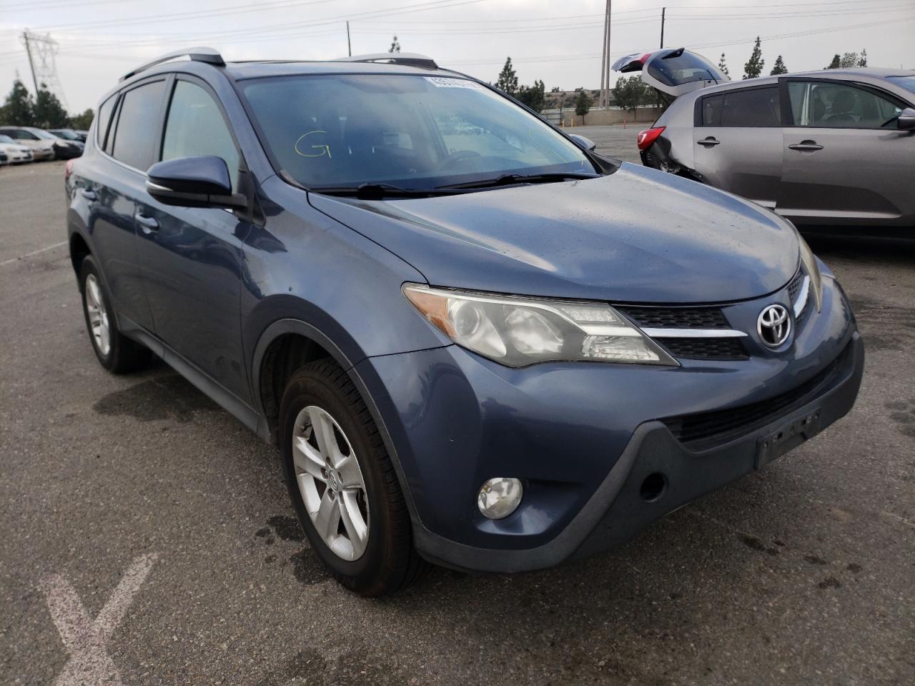 TOYOTA RAV4 XLE 2014 with VIN JTMRFREV2ED088726 - Photo from auction