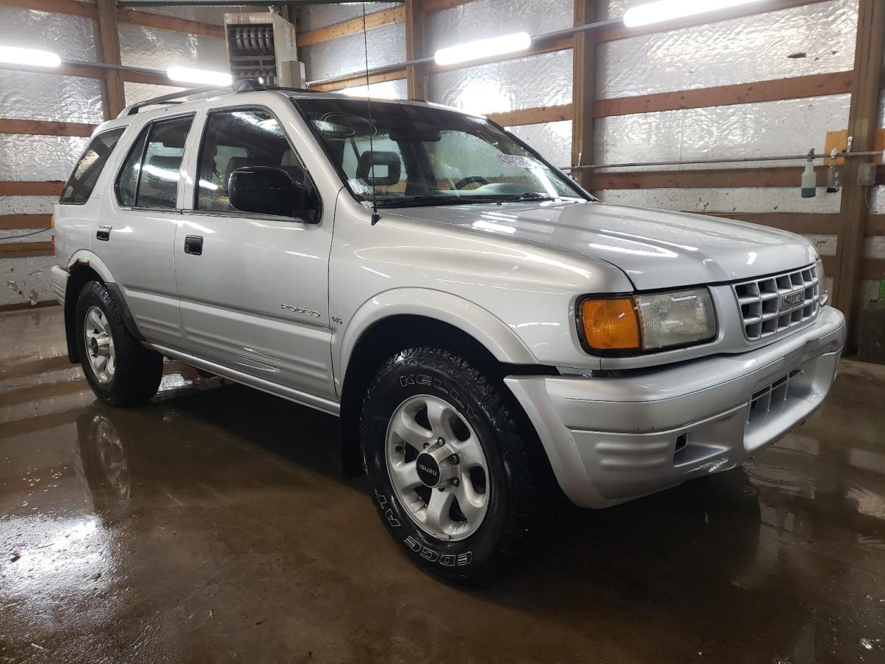ISUZU RODEO S 1999 with VIN 4S2CM58W3X4372172 - Photo from auction