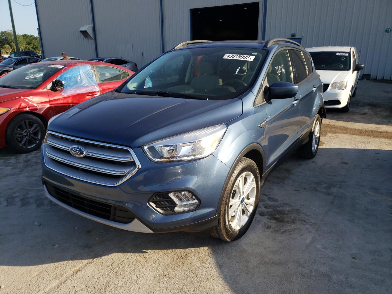 Photo 2 from auction – 2018 FORD ESCAPE SE with VIN 1FMCU0GD1JUA79517