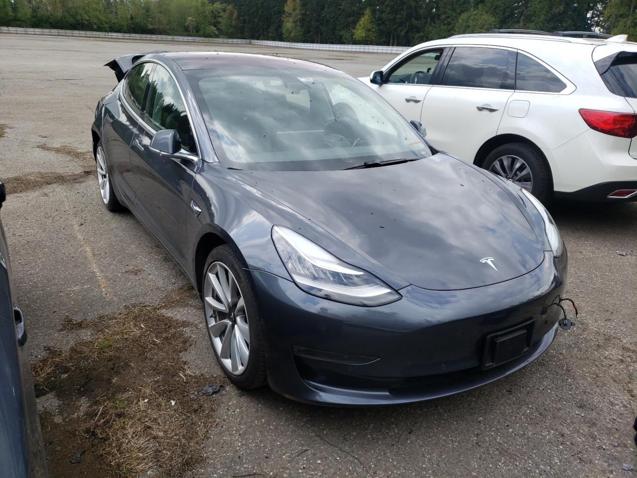 TESLA MODEL 3 2018 with VIN 5YJ3E1EA9JF050162 - Photo from auction