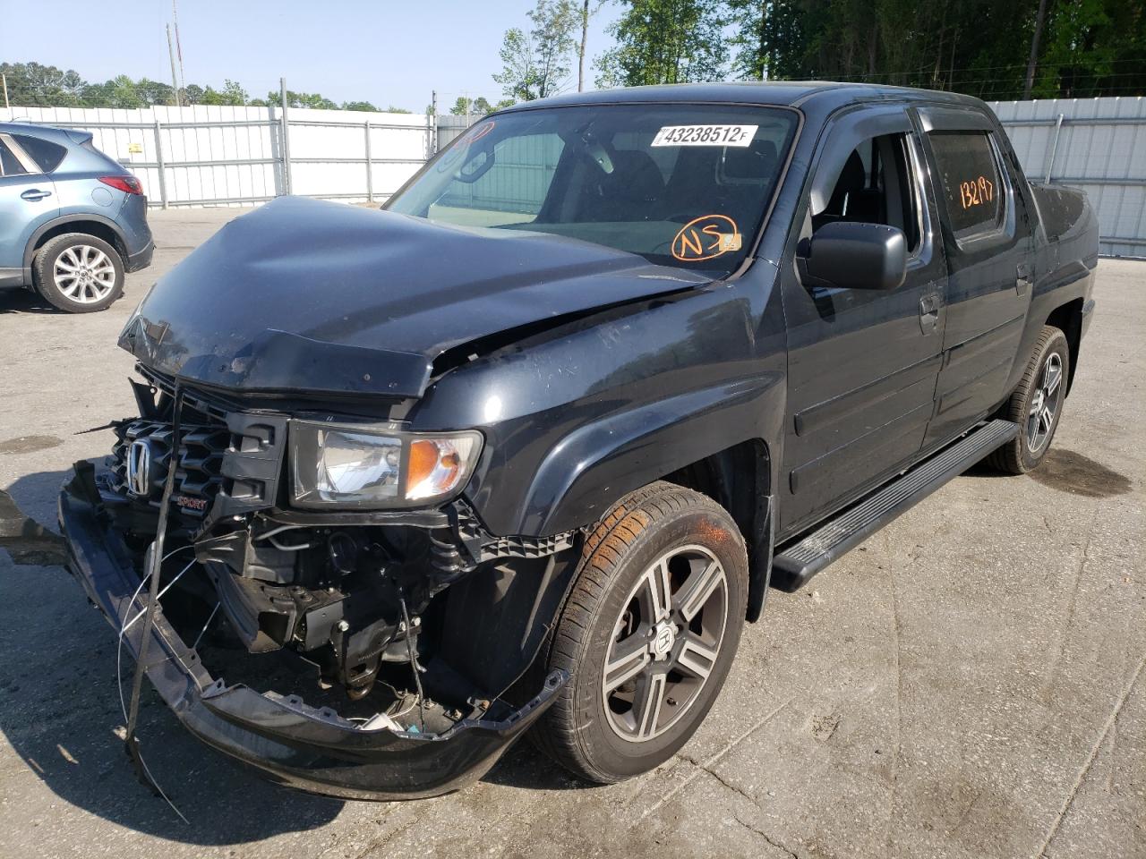 Photo 2 from auction – 2014 HONDA RIDGELINE with VIN 5FPYK1F74EB001384