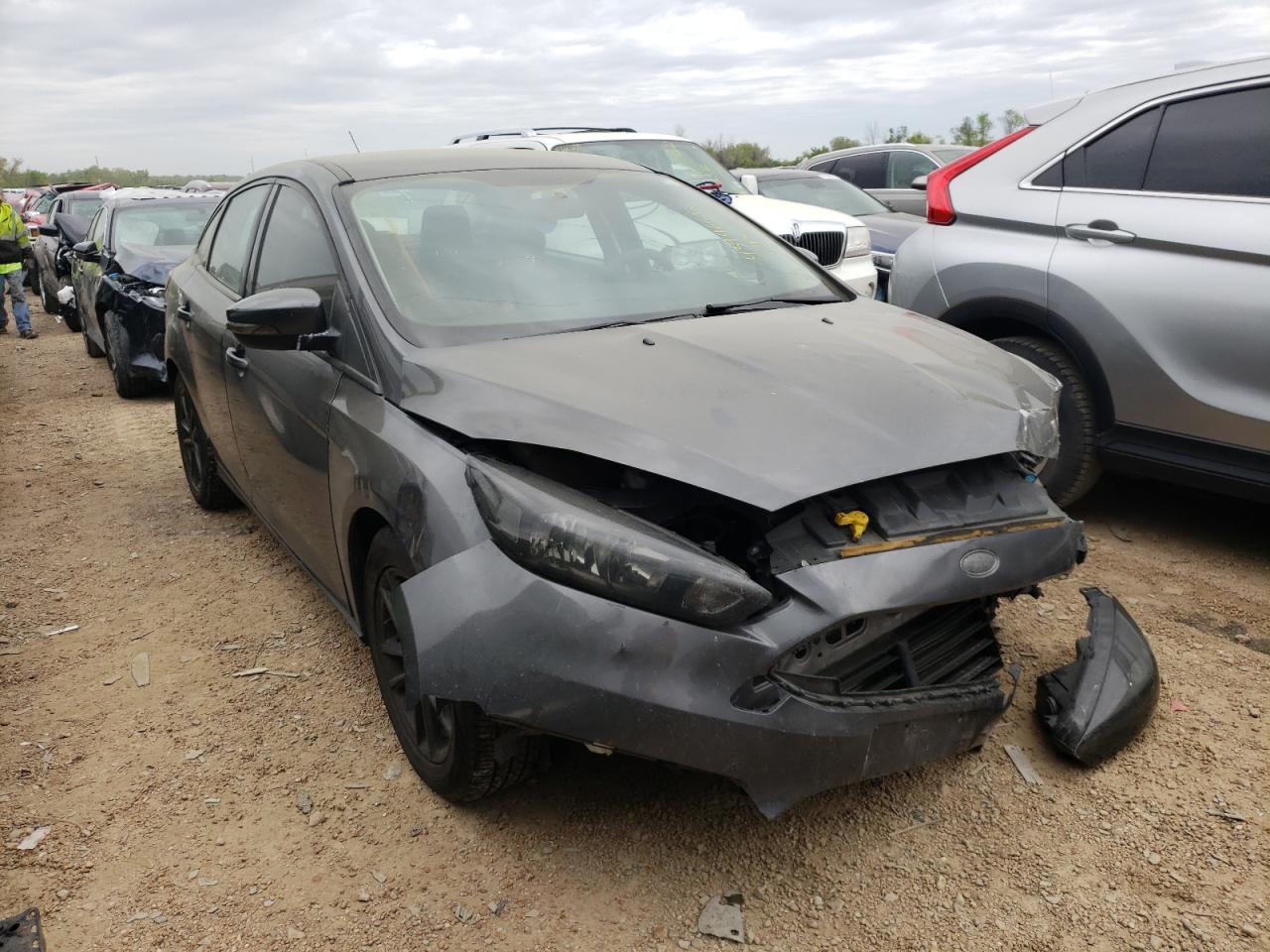 FORD FOCUS SE 2015 with VIN 1FADP3F2XFL385118 - Photo from auction