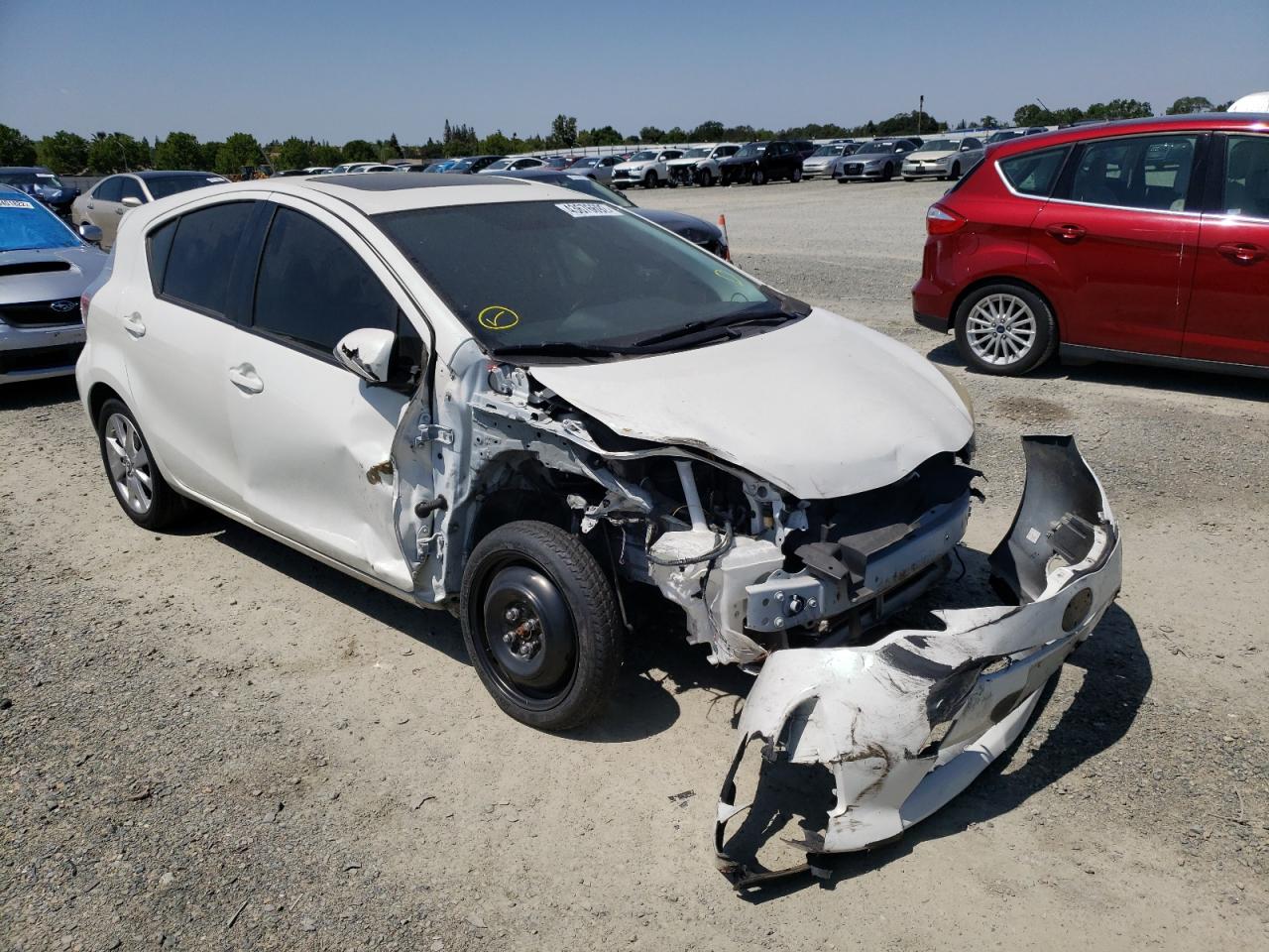TOYOTA PRIUS C 2014 with VIN JTDKDTB33E1084290 - Photo from auction