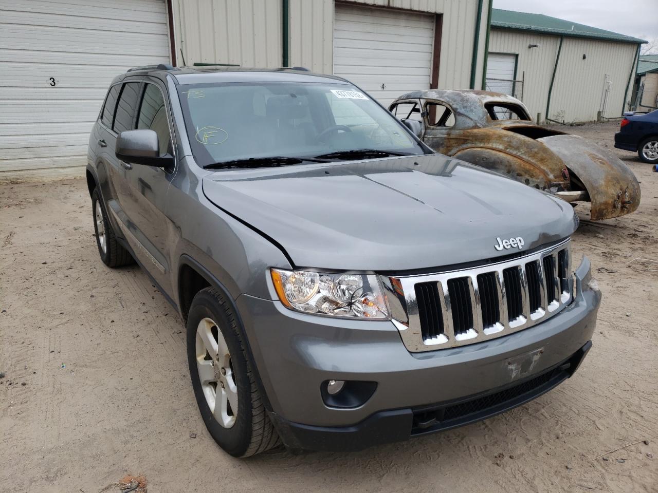 JEEP GRAND CHER 2011 with VIN 1J4RR4GG8BC680636 - Photo from auction