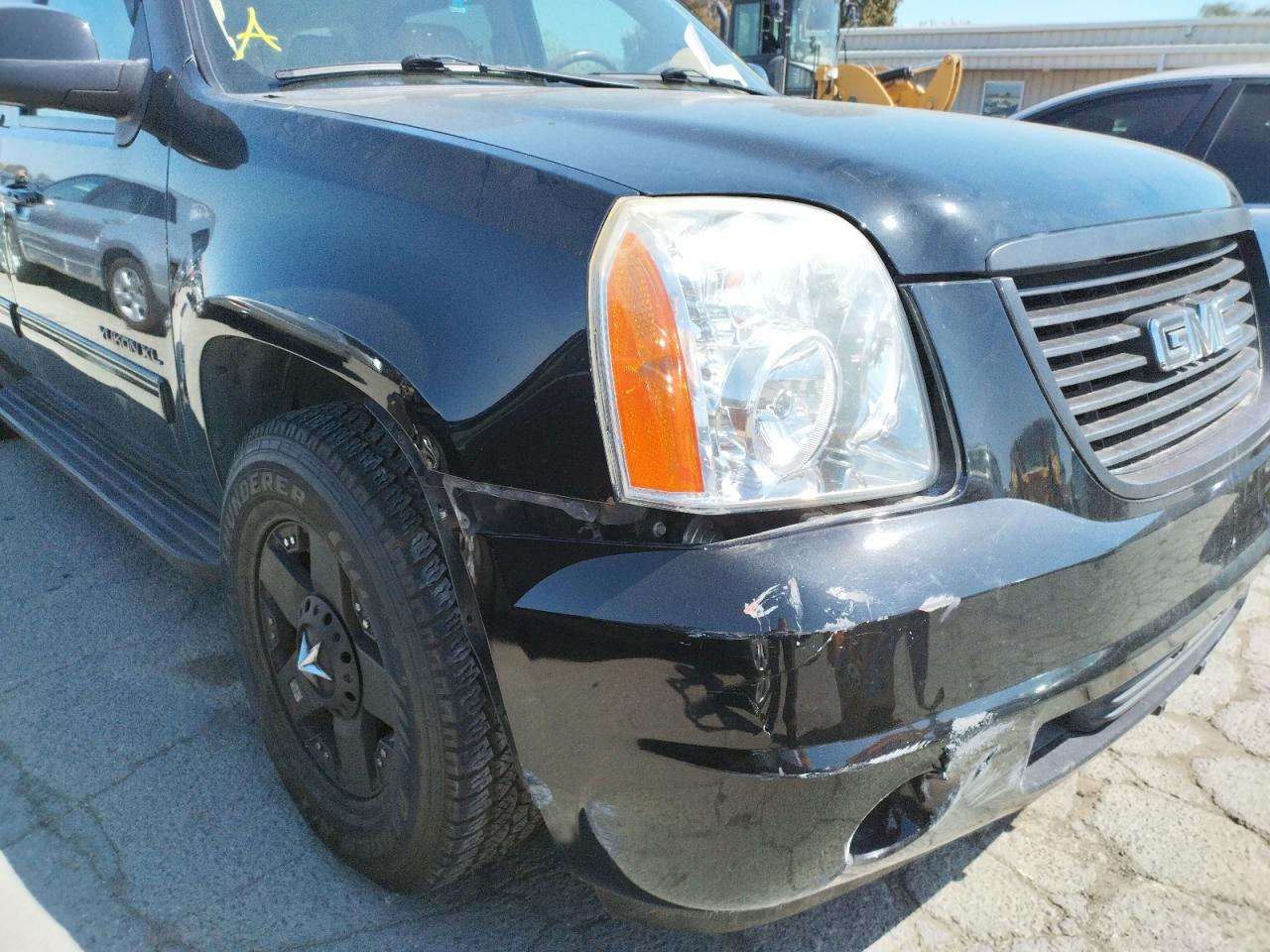 Photo 9 from auction – 2011 GMC YUKON XL K with VIN 1GKS2KE34BR282972