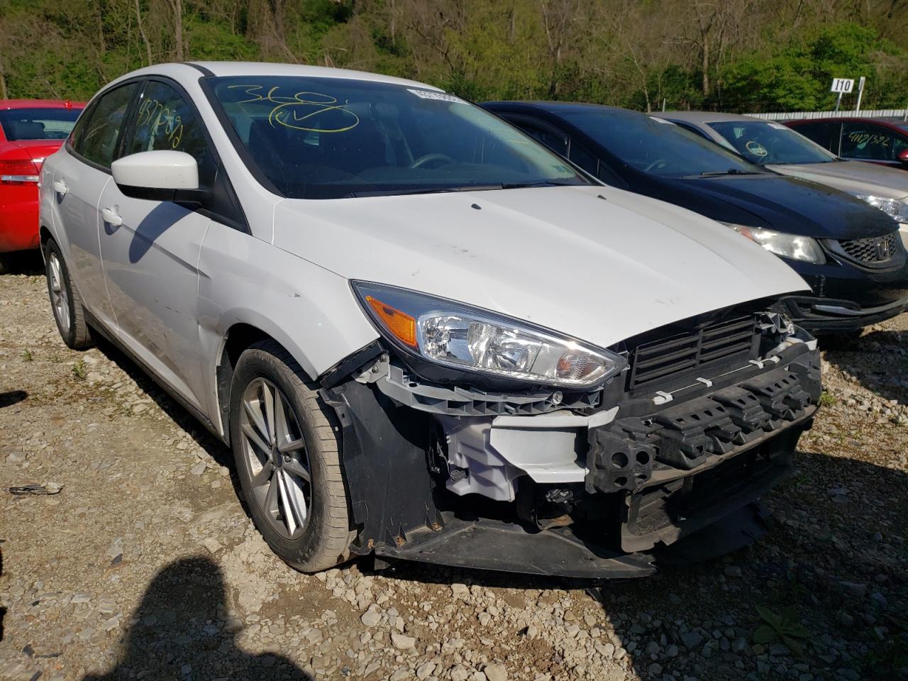 FORD FOCUS SE 2018 with VIN 1FADP3F23JL320524 - Photo from auction