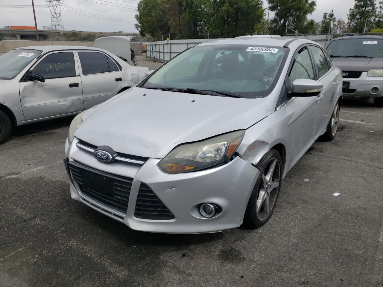 Photo 2 from auction – 2014 FORD FOCUS TITA with VIN 1FADP3J2XEL254809