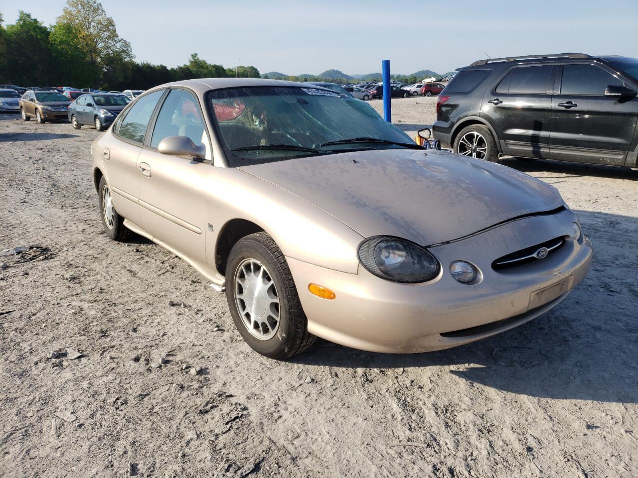 FORD TAURUS SE 1999 with VIN 1FAFP53S0XA101470 - Photo from auction