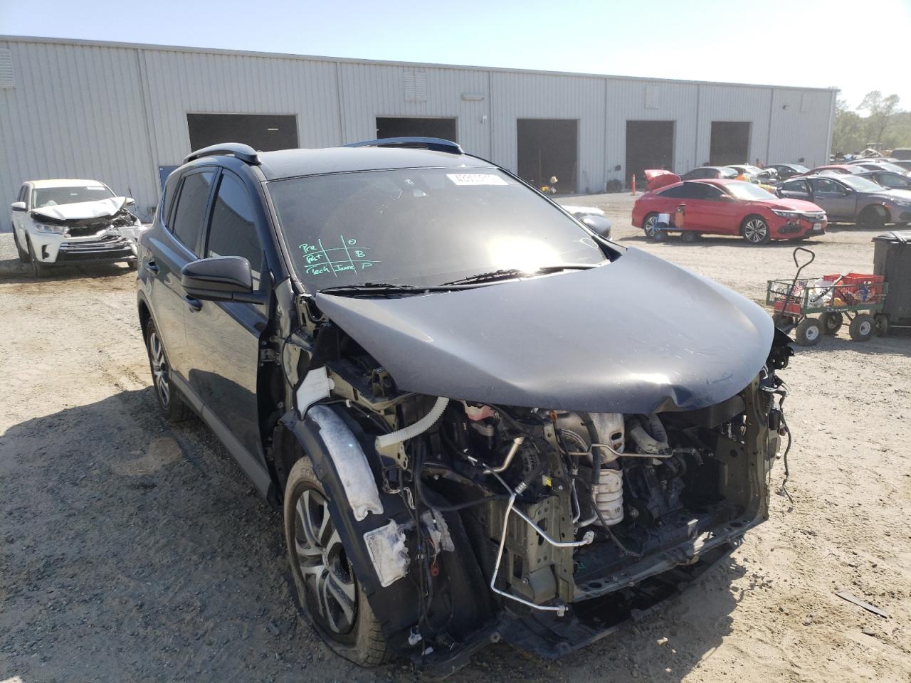 TOYOTA RAV4 LE 2018 with VIN 2T3ZFREV4JW432893 - Photo from auction