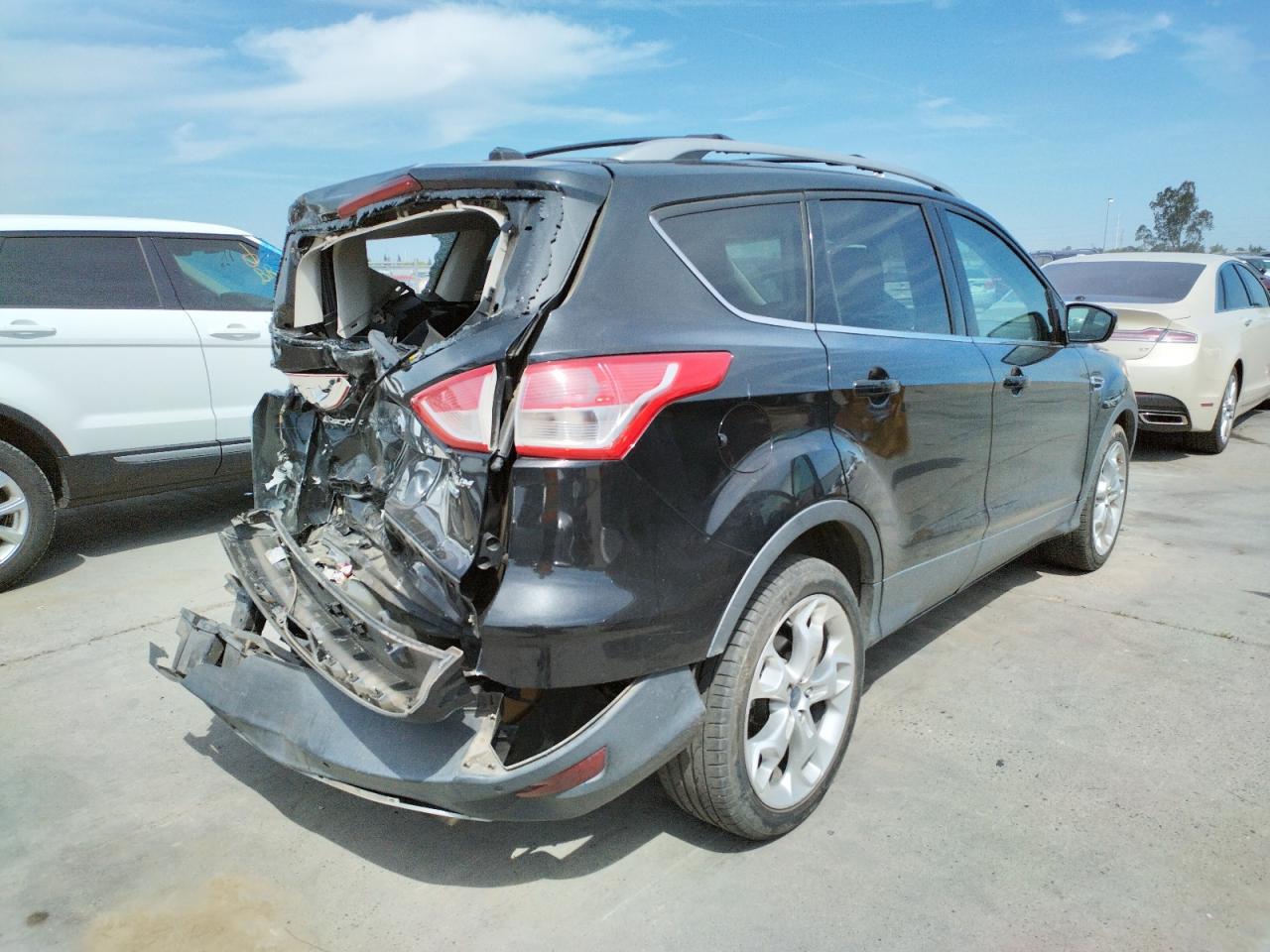 Photo 4 from auction – 2015 FORD ESCAPE TIT with VIN 1FMCU9J97FUC43790