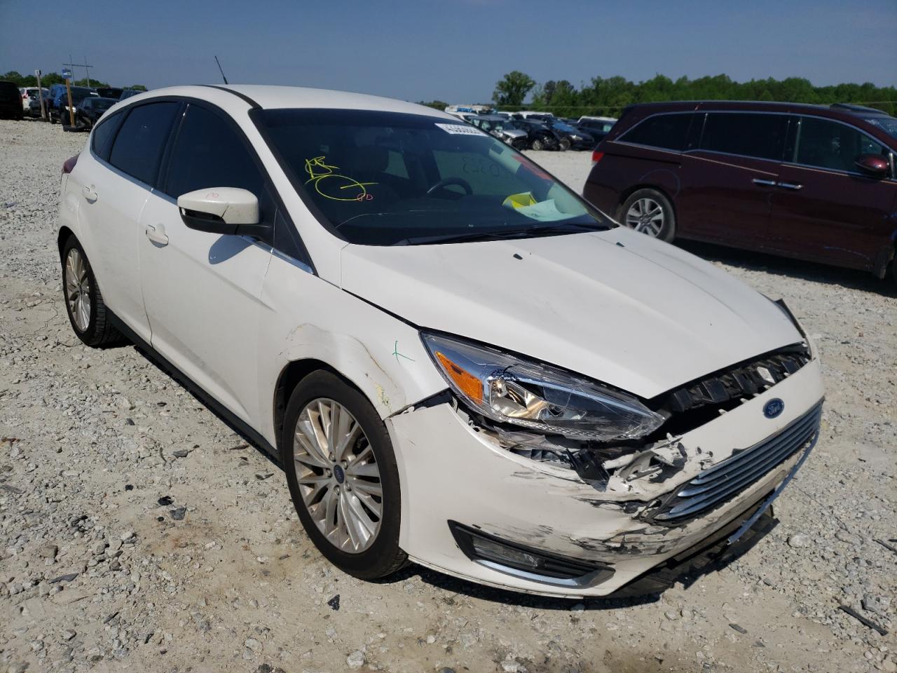 FORD FOCUS TITA 2016 with VIN 1FADP3N2XGL332678 - Photo from auction