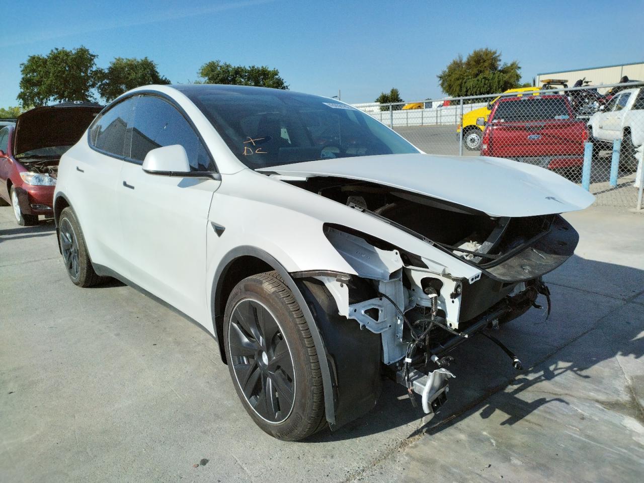 TESLA MODEL Y 2020 with VIN 5YJYGDEE3LF010571 - Photo from auction