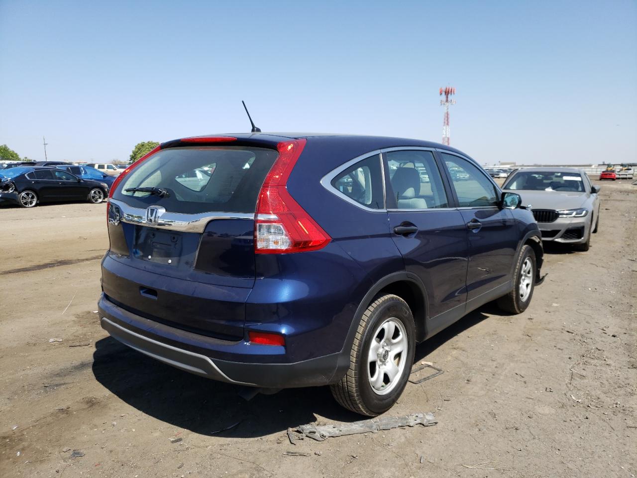 Photo 4 from auction – 2015 HONDA CR-V LX with VIN 3CZRM3H35FG707072