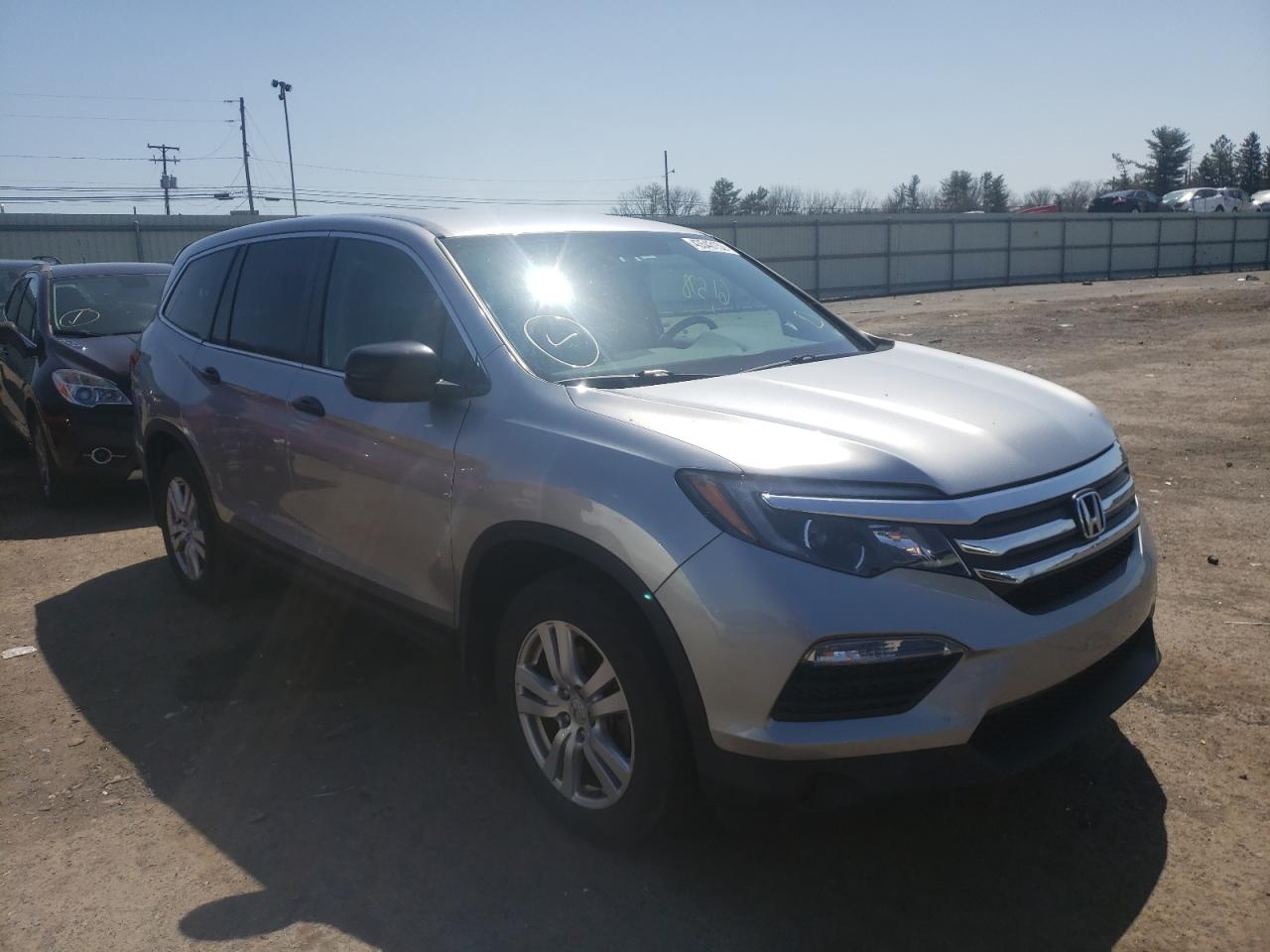 HONDA PILOT LX 2017 with VIN 5FNYF6H16HB007775 - Photo from auction