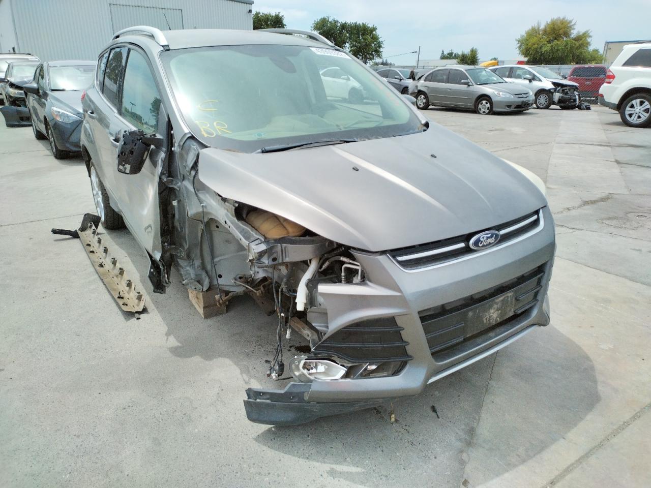 FORD ESCAPE TIT 2014 with VIN 1FMCU0J92EUB01728 - Photo from auction