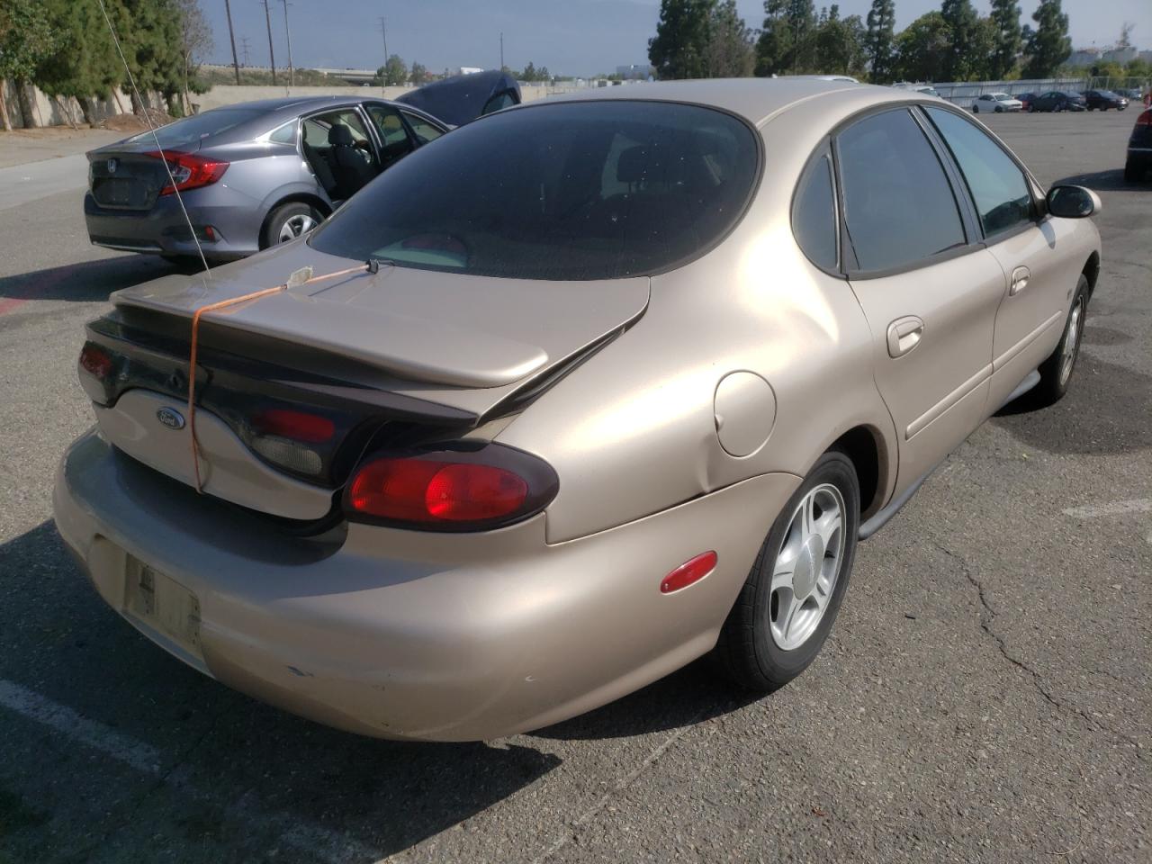 Photo 4 from auction – 1999 FORD TAURUS SE with VIN 1FAFP53S3XA222106
