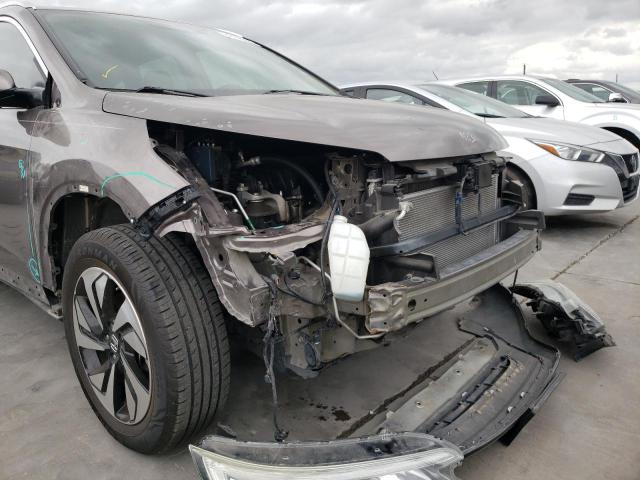 Photo 9 from auction – 2015 HONDA CR-V TOURI with VIN 5J6RM3H95FL019290