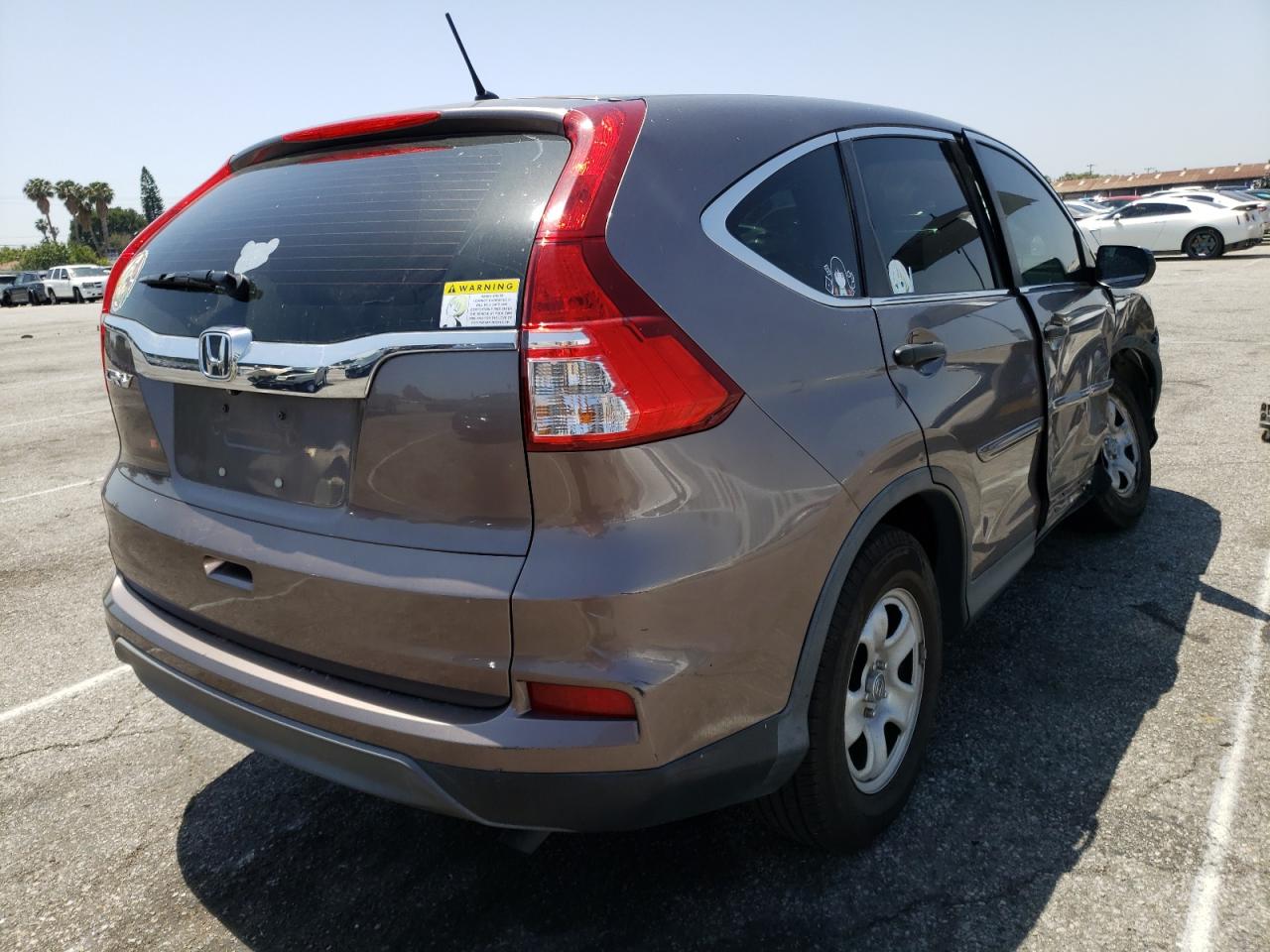 Photo 4 from auction – 2015 HONDA CR-V LX with VIN 3CZRM3H32FG705473