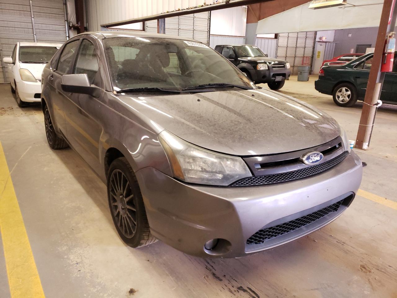 FORD FOCUS SES 2011 with VIN 1FAHP3GN1BW140324 - Photo from auction