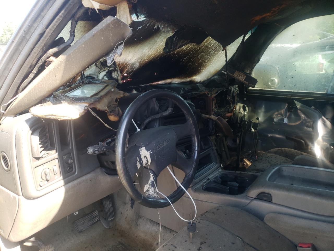 Photo 9 from auction – 2004 GMC YUKON with VIN 1GKEC13Z44R199069