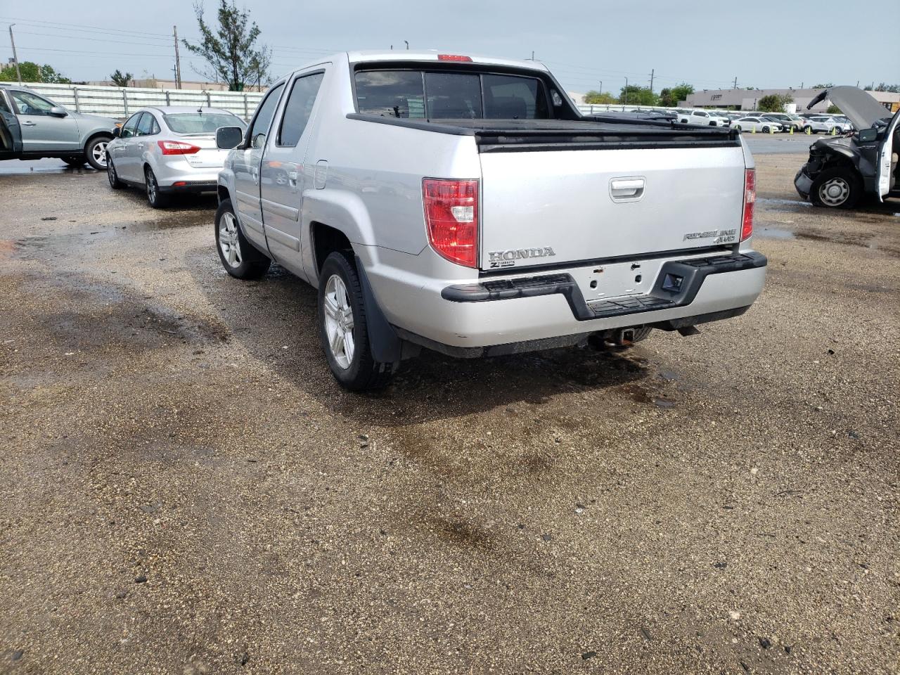 Photo 3 from auction – 2010 HONDA RIDGELINE with VIN 5FPYK1F56AB007759