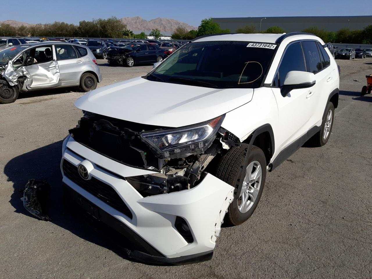 Photo 2 from auction – 2021 TOYOTA RAV4 XLE with VIN 2T3W1RFV7MC128849
