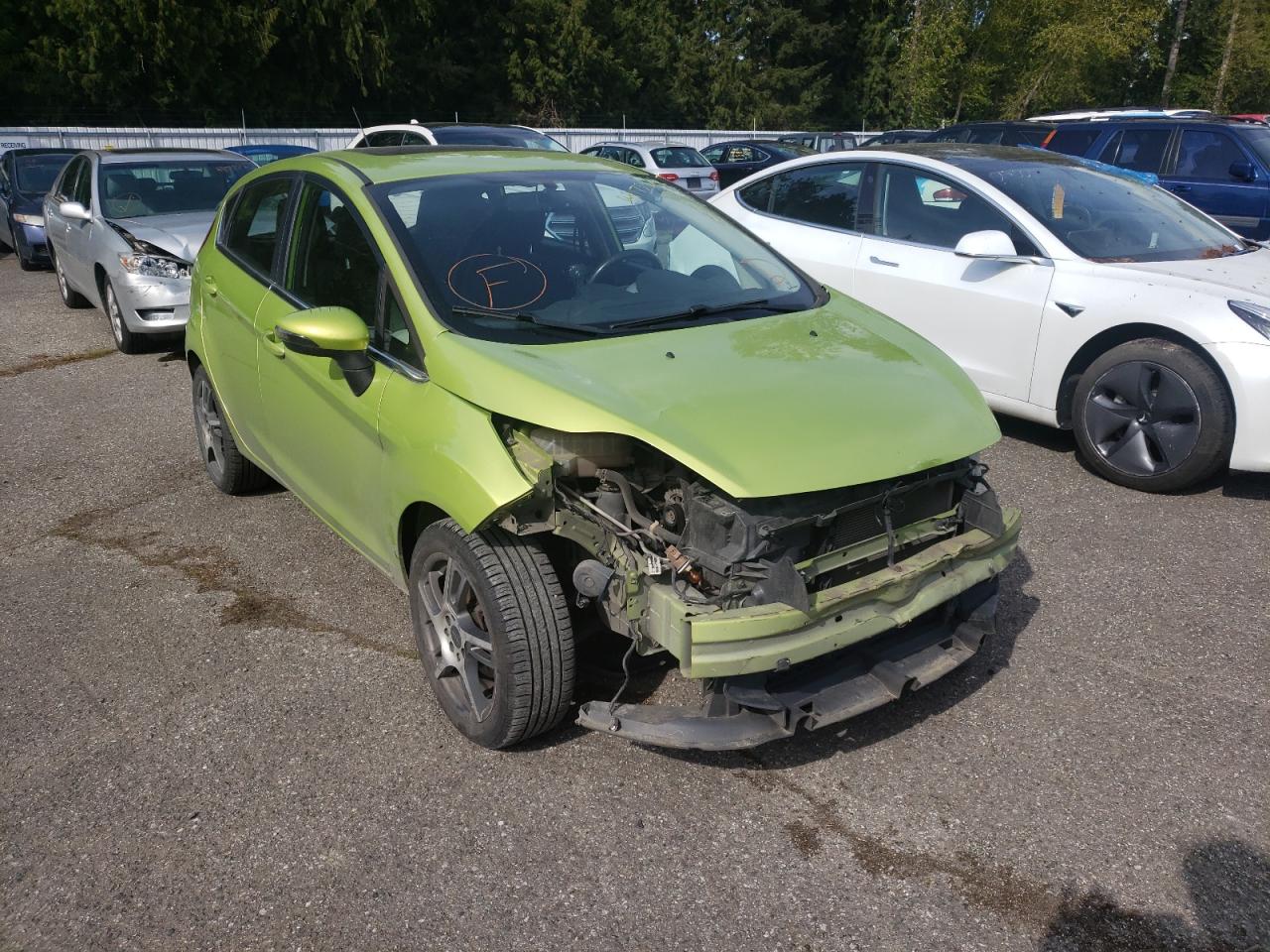 FORD FIESTA SES 2012 with VIN 3FADP4FJ7CM103234 - Photo from auction