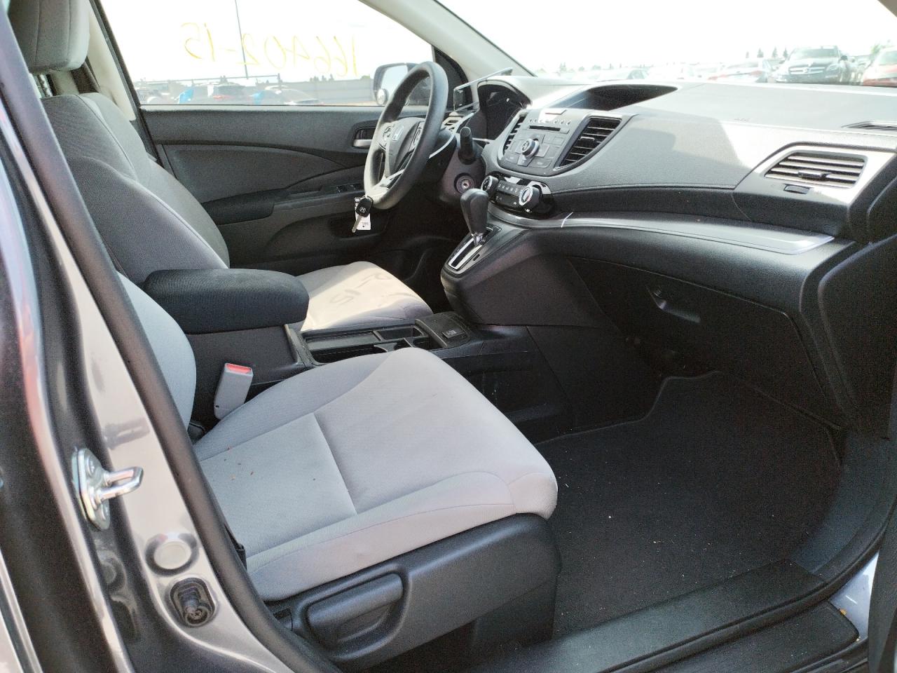Photo 5 from auction – 2015 HONDA CR-V LX with VIN 3CZRM3H32FG716103