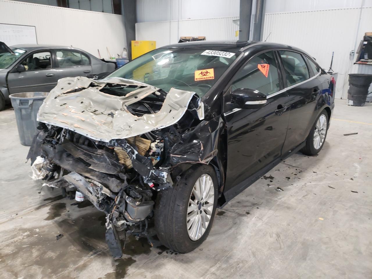 Photo 2 from auction – 2015 FORD FOCUS TITA with VIN 1FADP3J23FL292397