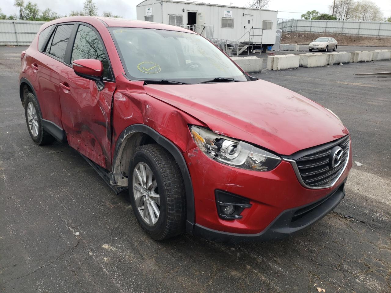MAZDA CX-5 TOURI 2016 with VIN JM3KE2CY6G0694136 - Photo from auction