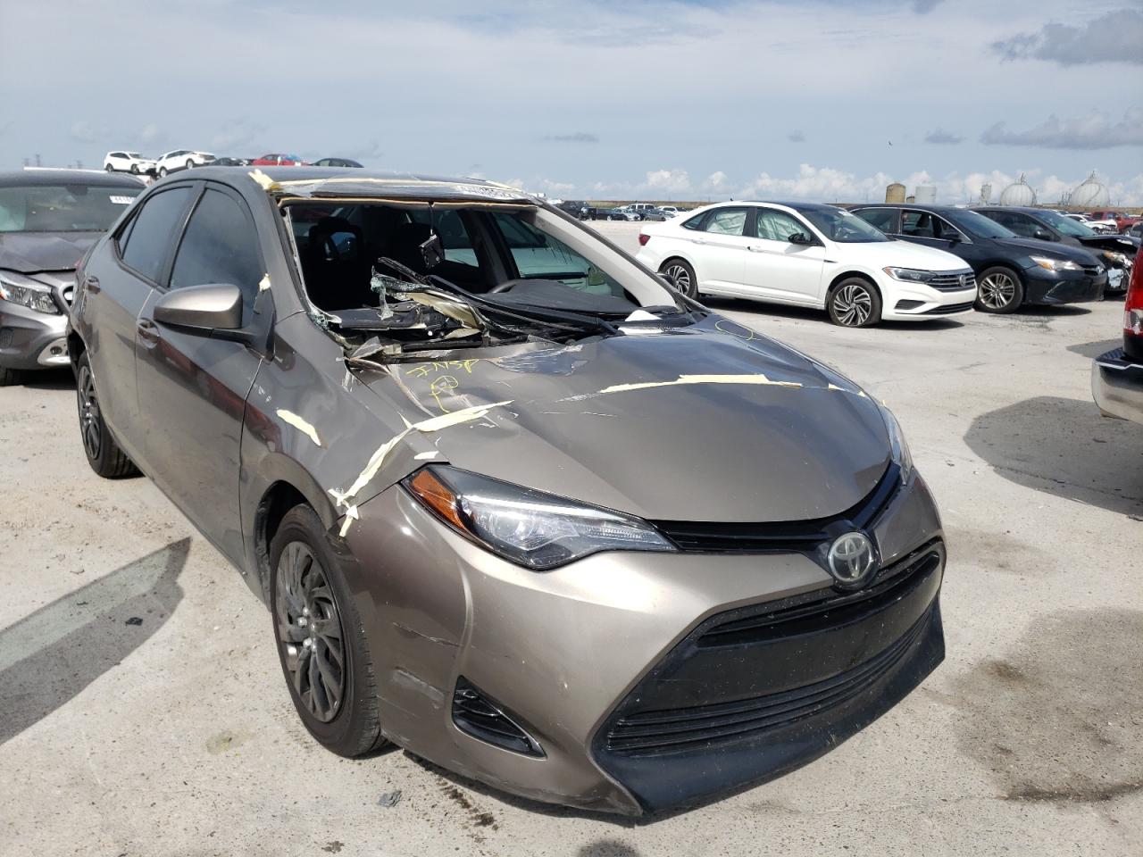 TOYOTA COROLLA L 2017 with VIN 5YFBURHE4HP660285 - Photo from auction