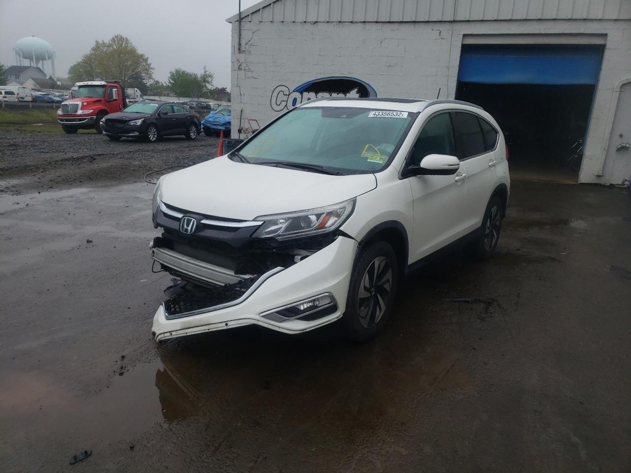 Photo 13 from auction – 2016 HONDA CR-V TOURI with VIN 5J6RM4H90GL093983