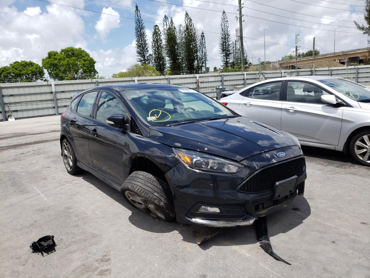FORD FOCUS ST 2017 with VIN 1FADP3L93HL280991 - Photo from auction