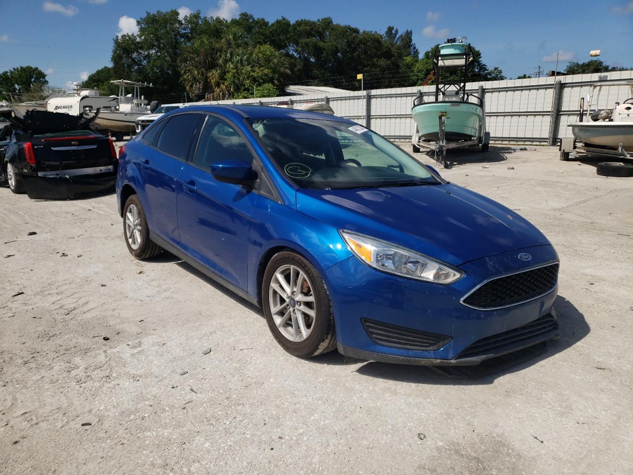 FORD FOCUS SE 2018 with VIN 1FADP3F21JL319601 - Photo from auction